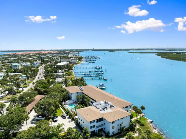 an aerial view of a house with a lake view