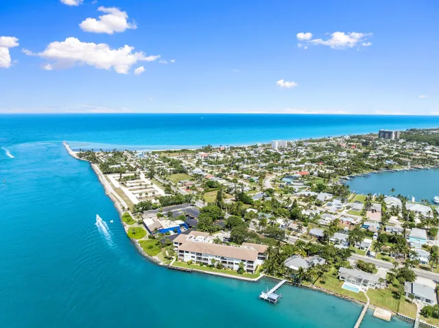 a view of a hallway with wooden floor and entryway