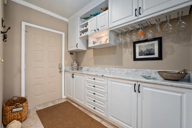 a living room with furniture and kitchen view