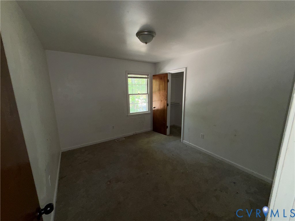 1607 Old Iron Road Hopewell, VA 23860 - Photo 9 of 12 an empty room with windows