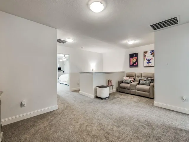a kitchen with stainless steel appliances granite countertop a table chairs sink and cabinets