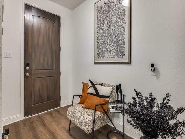 a view of a room with table and chairs