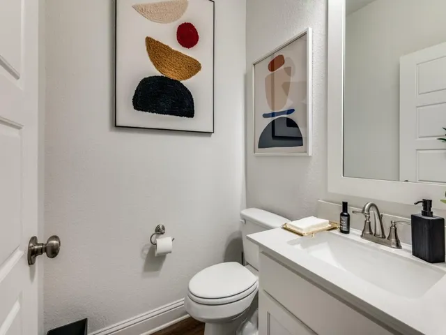 a bedroom with a bed and a table