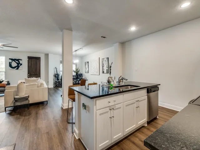 a bathroom with a toilet sink and vanity