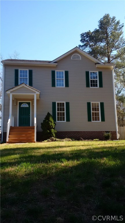 6725 Brambleton Road Chesterfield, VA 23832 - Photo 1 of 17 a front view of a house with a garden