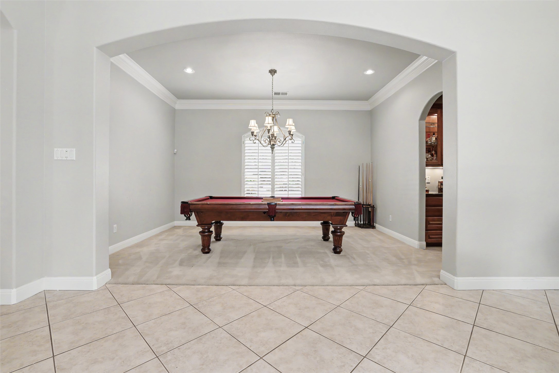 33 Meadows End Georgetown, TX 78628 - Photo 29 of 40 An inviting game room features a classic billiard table beneath an elegant chandelier.