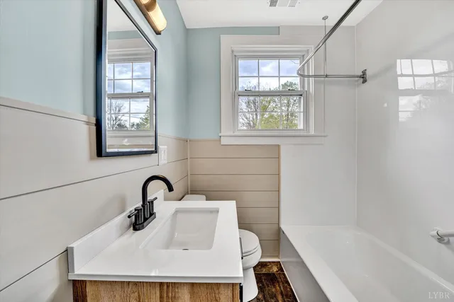 a bathroom with a sink and a bathtub