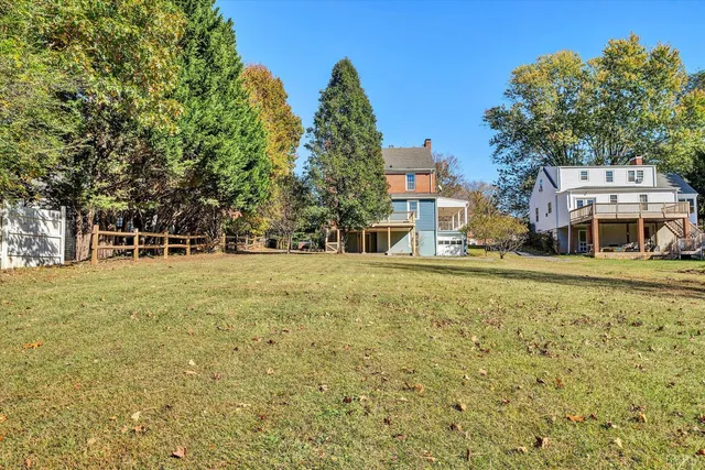 a front view of a building with a garden
