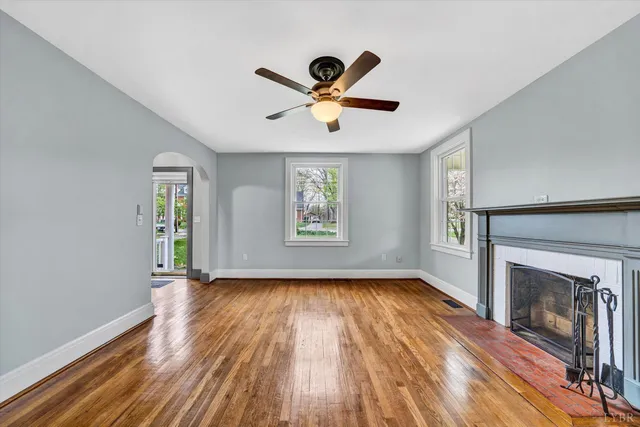 a view of a porch with wooden floor and roof with a floor to ceiling window