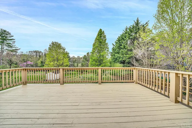 a view of deck and yard in the back