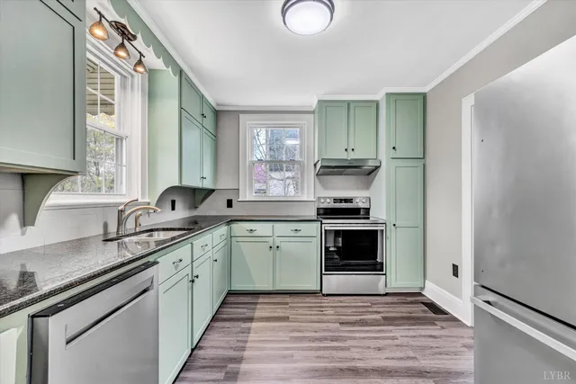 a kitchen with a sink stove and cabinets