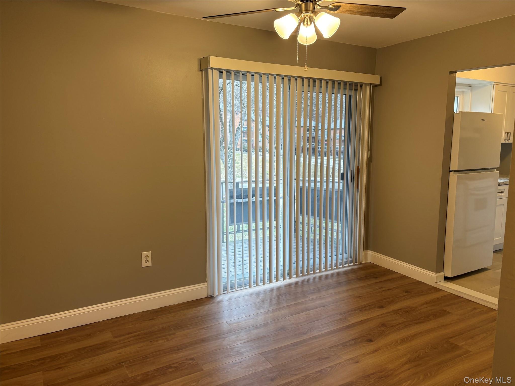 43 Tanager Road, Unit 4303 Monroe, NY 10950 - Photo 8 of 9 Unfurnished room featuring dark wood-type flooring and a ceiling fan