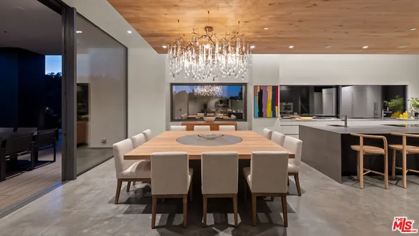 a kitchen with stainless steel appliances a sink and a refrigerator