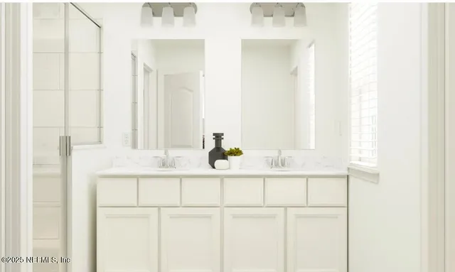 a bedroom with a bed and a potted plant