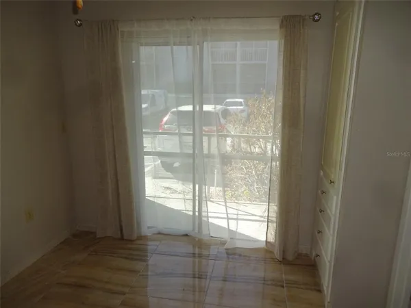 a view of an empty room and window