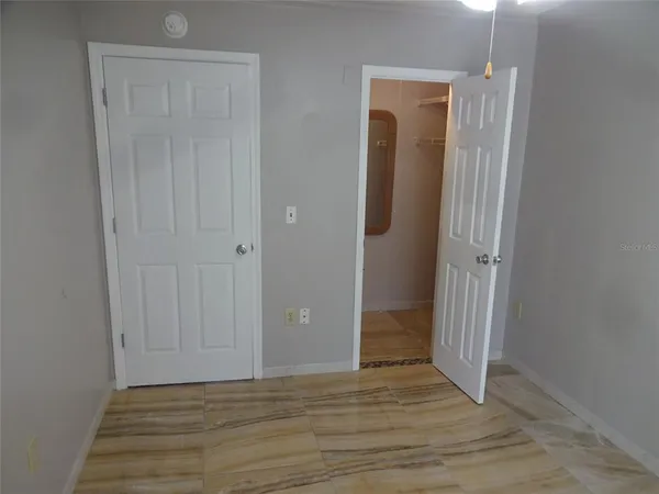 a view of a bathroom with wooden floor
