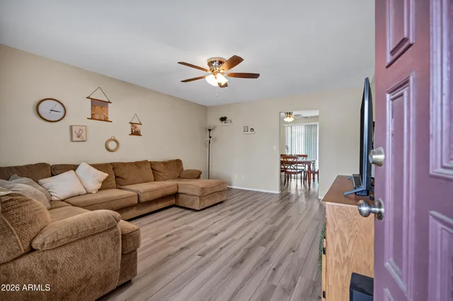 a living room with a table and chairs