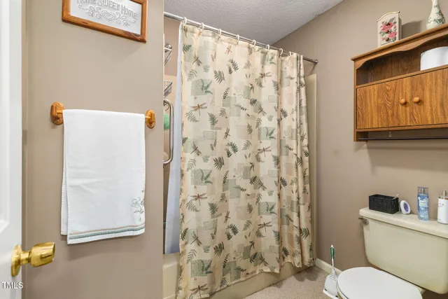 a bedroom with a bed and a bookshelf