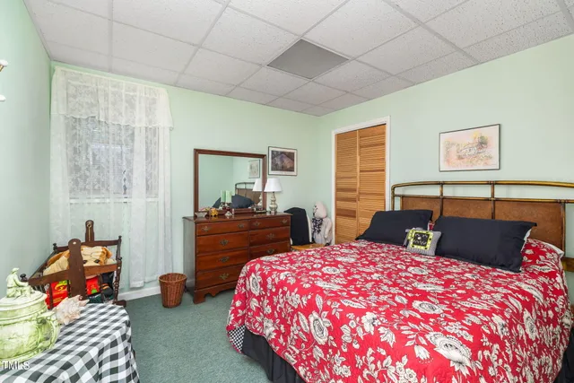 a room with pool table and windows