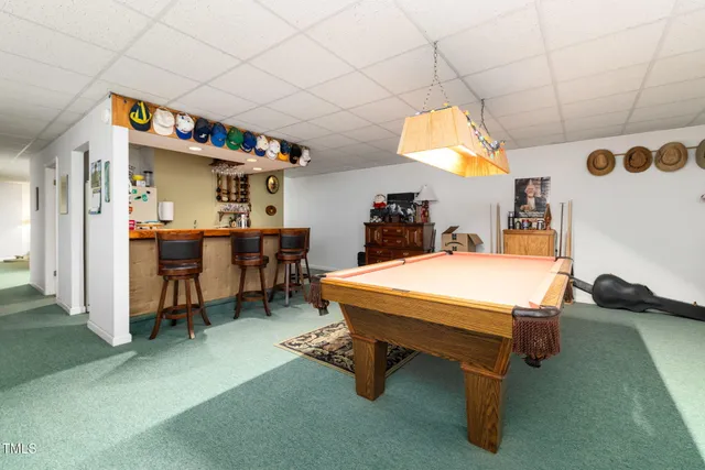 a very nice looking room with a table and a fireplace