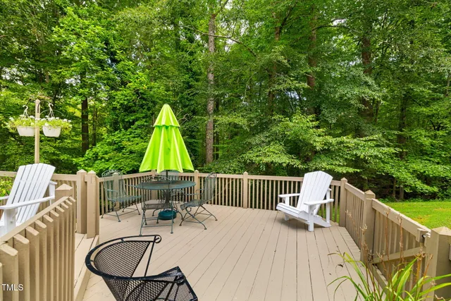 a view of a chair and tables in the balcony