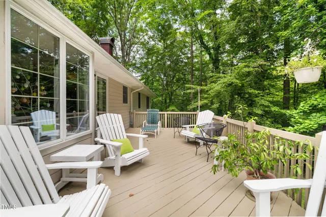 a view of deck with a small yard