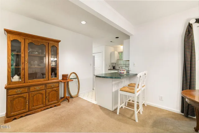 a kitchen with granite countertop a sink stove and cabinets