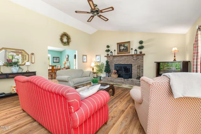 a living room with furniture fireplace and a fireplace