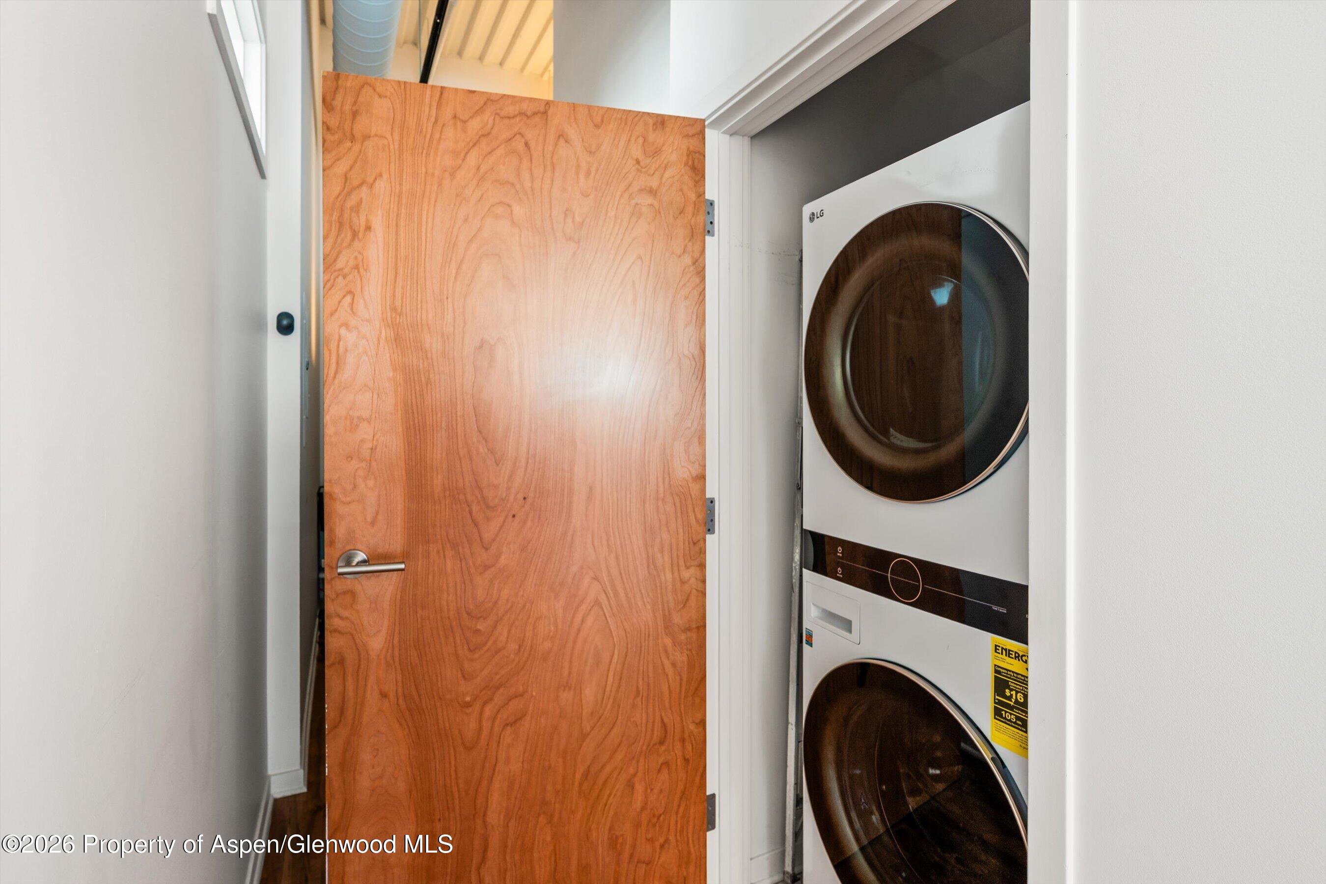 361 Robinson Street, Unit 208 Basalt, CO 81621 - Photo 11 of 15 a view of a hallway with washer and dryer