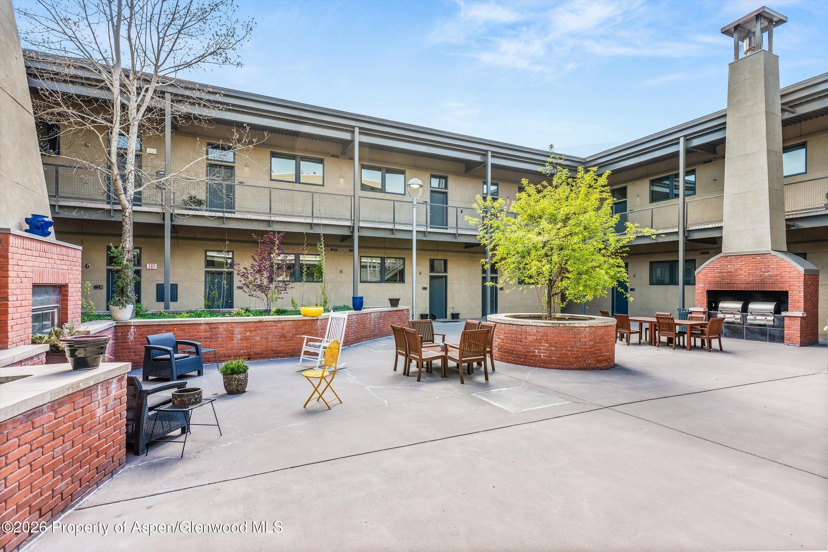 361 Robinson Street, Unit 208 Basalt, CO 81621 - Photo 12 of 15 a building outdoor space with patio furniture and potted plants