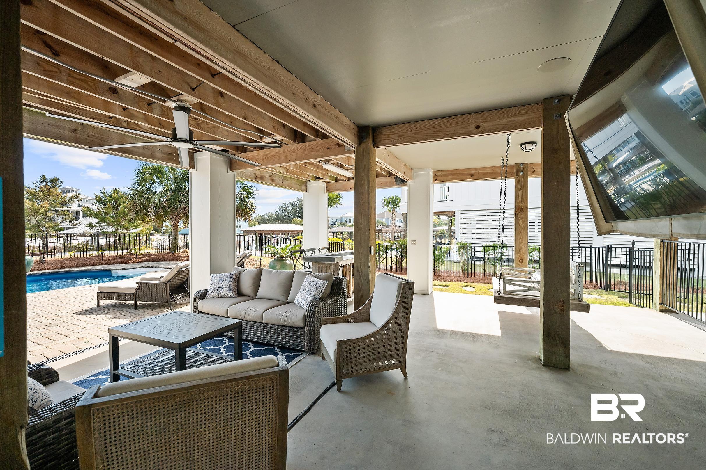 33186 Marlin Key Drive Orange Beach, AL 36561 - Photo 81 of 87 Fenced backyard featuring a patio, outdoor lounge area, and a ceiling fan