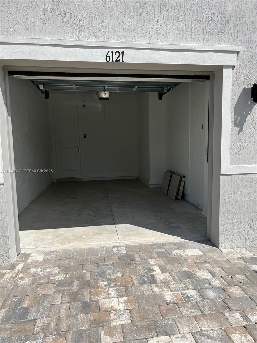6121 Rancho Lane Greenacres, FL 33415 - Photo 15 of 17 a view of a garage