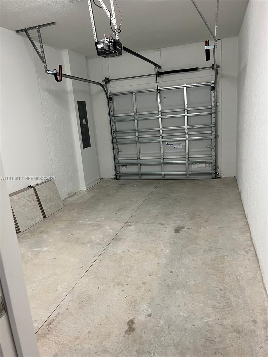 6121 Rancho Lane Greenacres, FL 33415 - Photo 16 of 17 a view of a garage