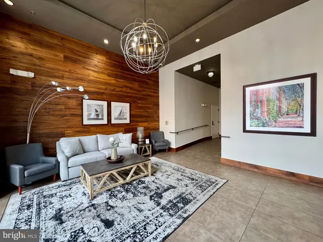 a living room with couch and a dining table