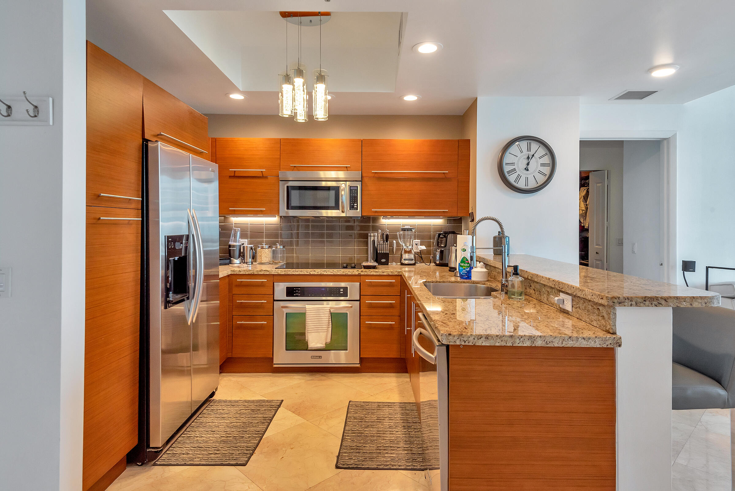 2641 North Flamingo Road, Unit 2503N Sunrise, FL 33323 - Photo 11 of 47 a kitchen with stainless steel appliances granite countertop a stove a sink and a refrigerator