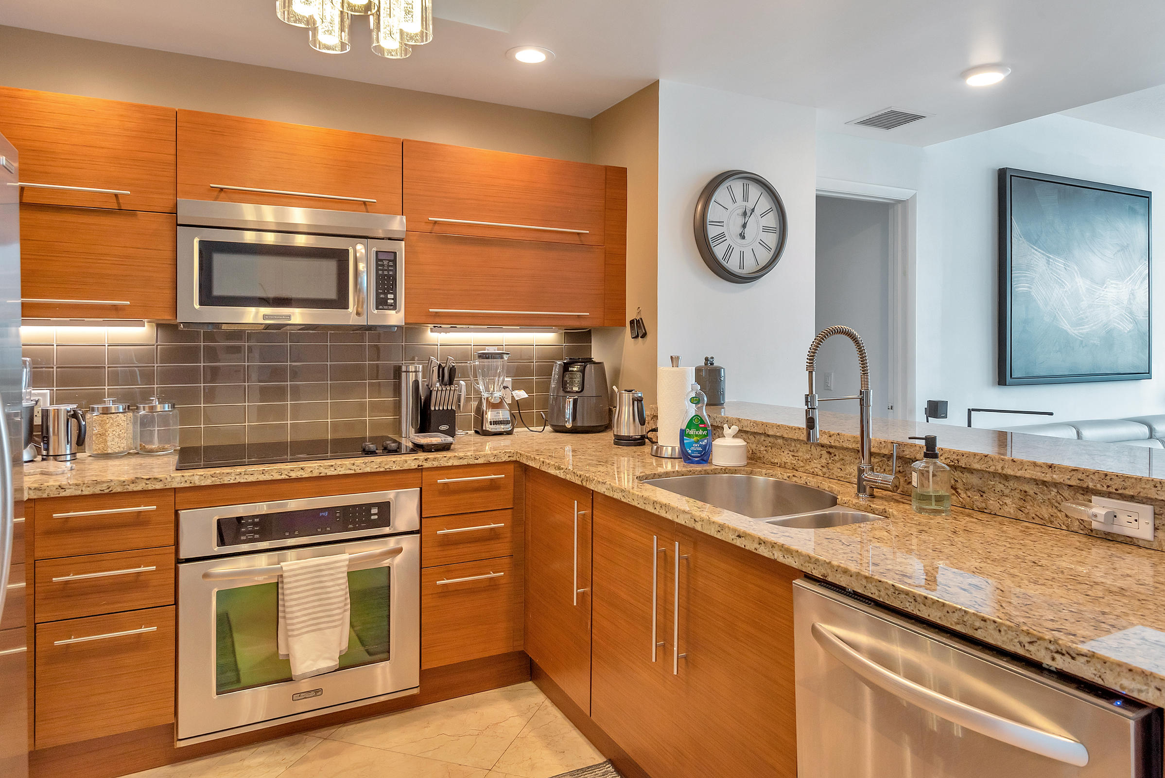 2641 North Flamingo Road, Unit 2503N Sunrise, FL 33323 - Photo 12 of 47 a kitchen with stainless steel appliances granite countertop a stove and a sink