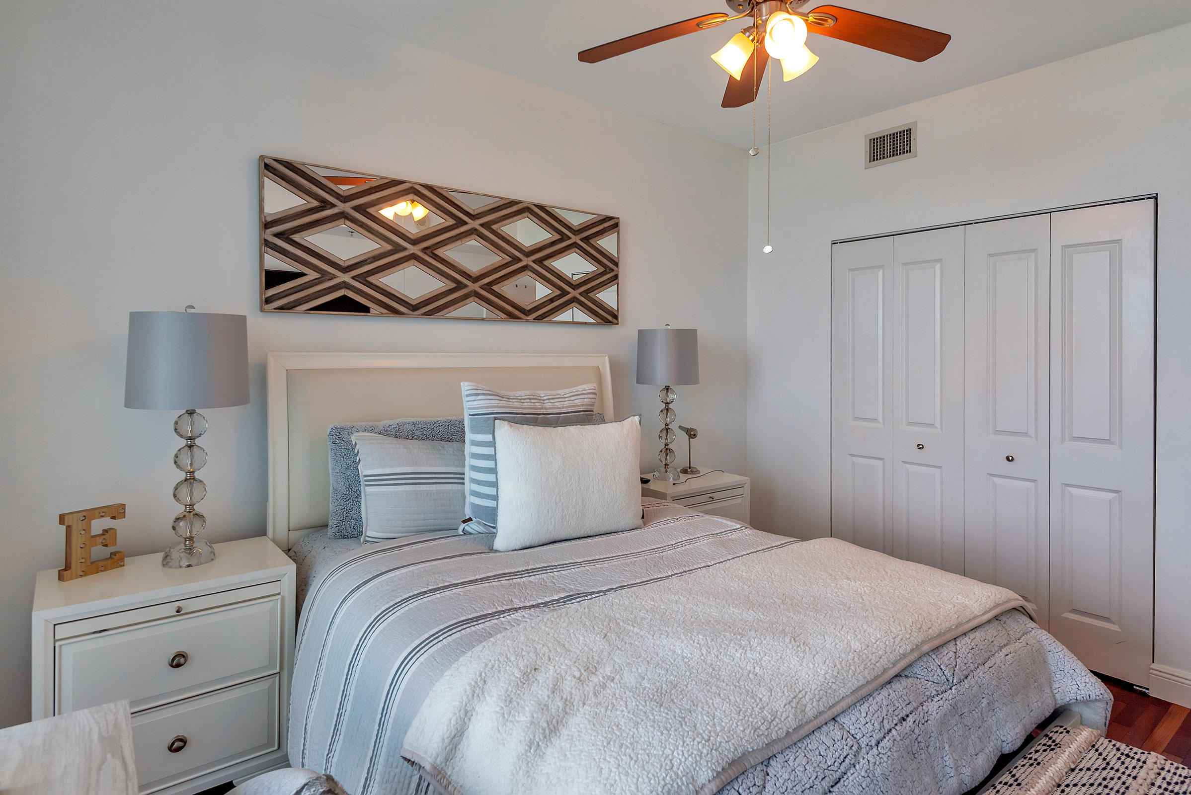 2641 North Flamingo Road, Unit 2503N Sunrise, FL 33323 - Photo 20 of 47 a bedroom with a bed and a chandelier