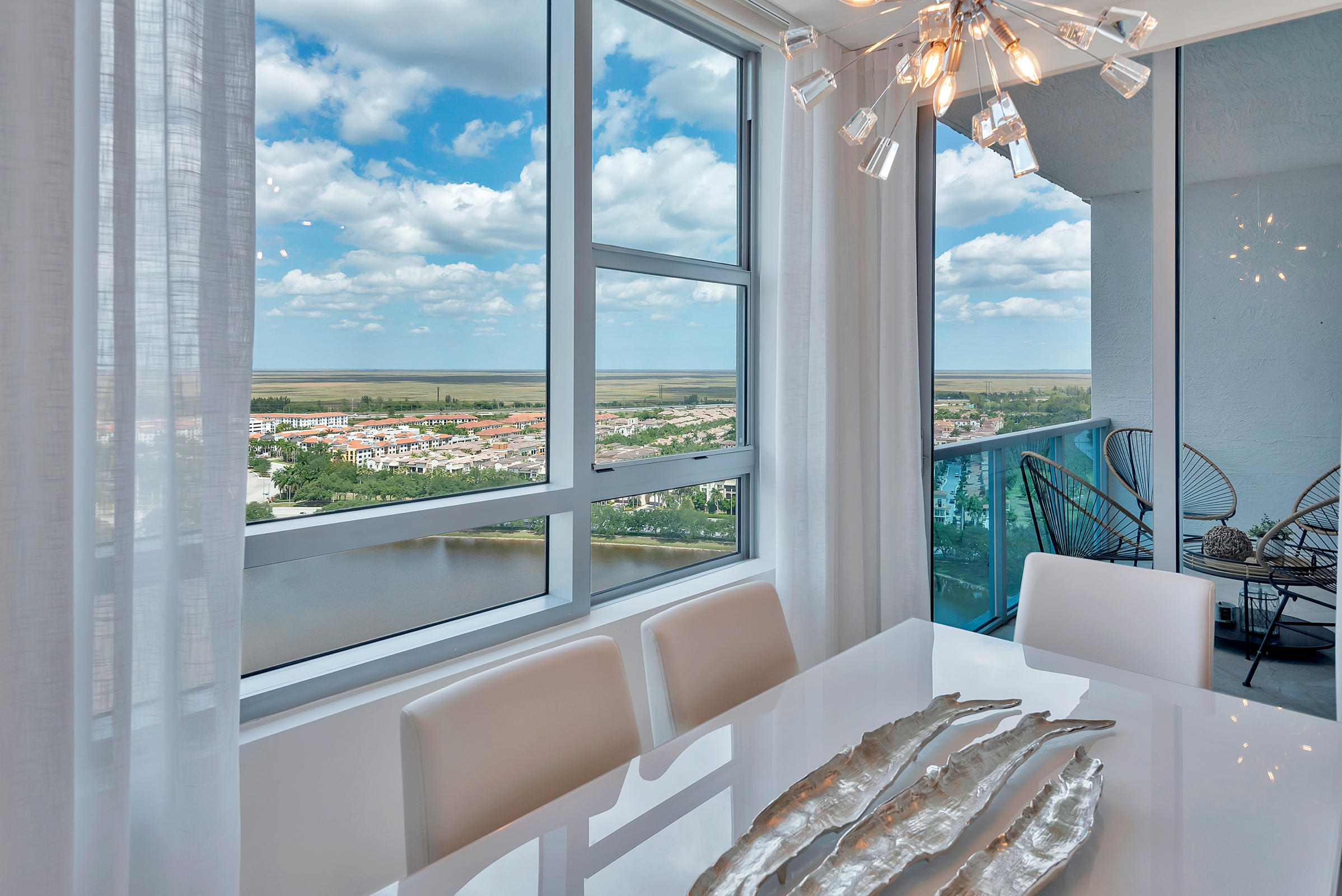 2641 North Flamingo Road, Unit 2503N Sunrise, FL 33323 - Photo 4 of 47 a view of a balcony with chair and outside view