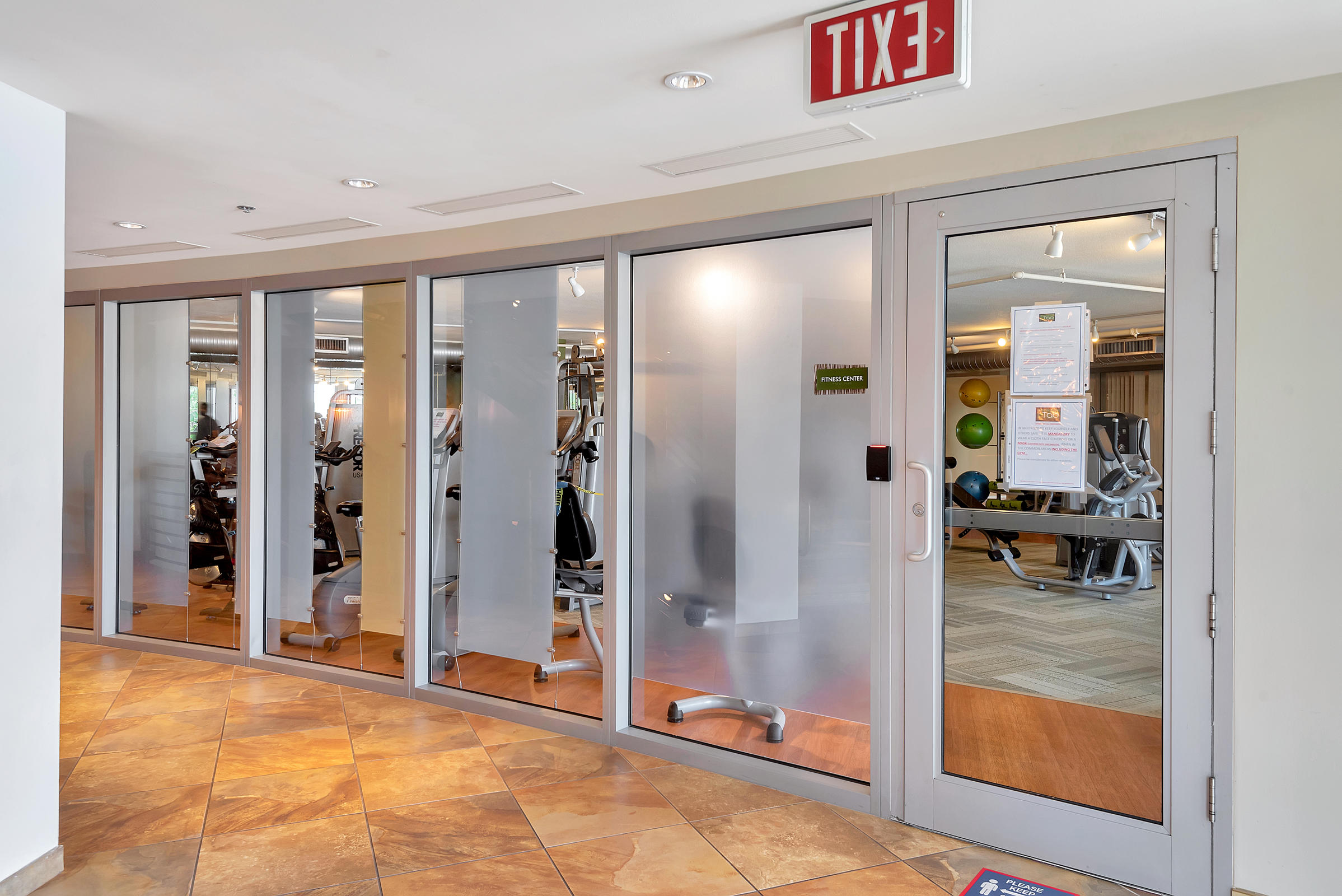 2641 North Flamingo Road, Unit 2503N Sunrise, FL 33323 - Photo 41 of 47 a view of a hallway with bathroom and glass door