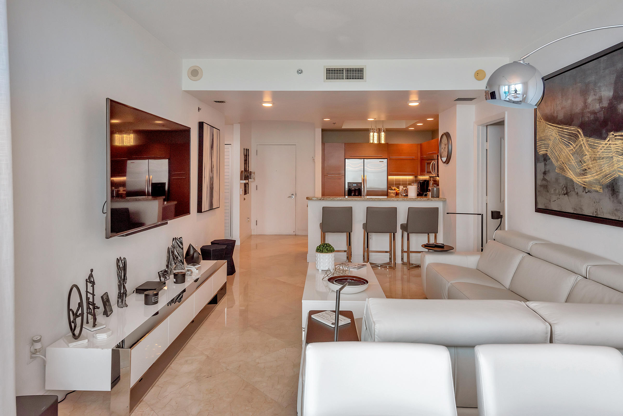 2641 North Flamingo Road, Unit 2503N Sunrise, FL 33323 - Photo 6 of 47 a living room with furniture and wooden floor