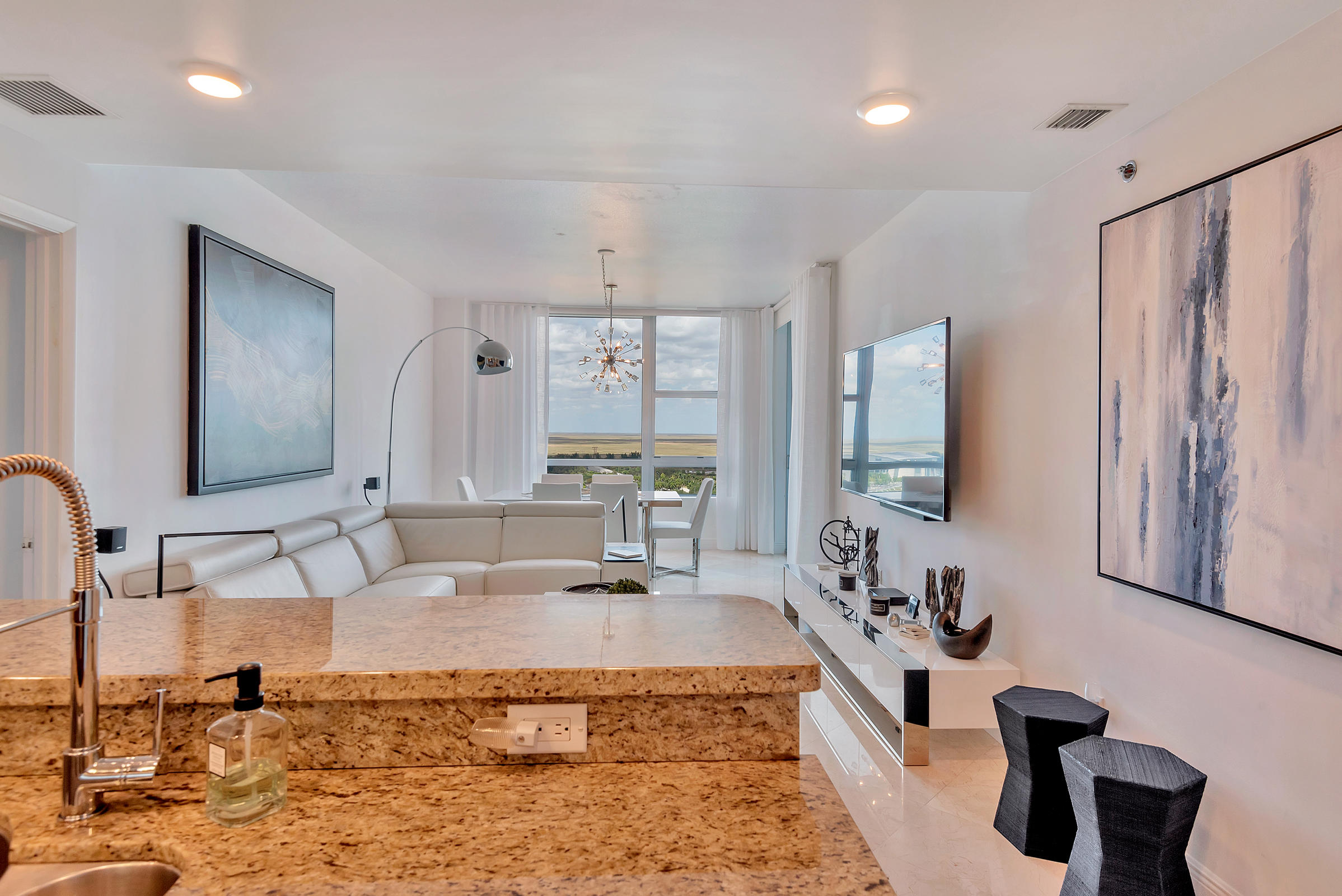 2641 North Flamingo Road, Unit 2503N Sunrise, FL 33323 - Photo 10 of 47 a spacious bathroom with a large mirror and a sink