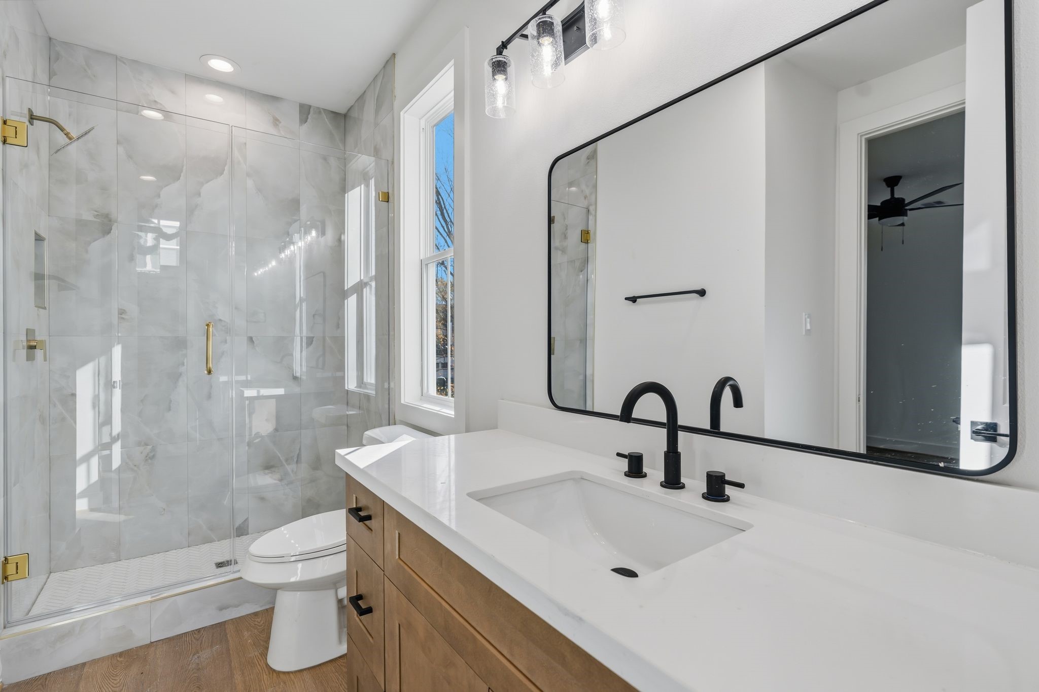 1140 West 16th Street Houston, TX 77008 - Photo 19 of 23 a bathroom with a sink toilet and shower