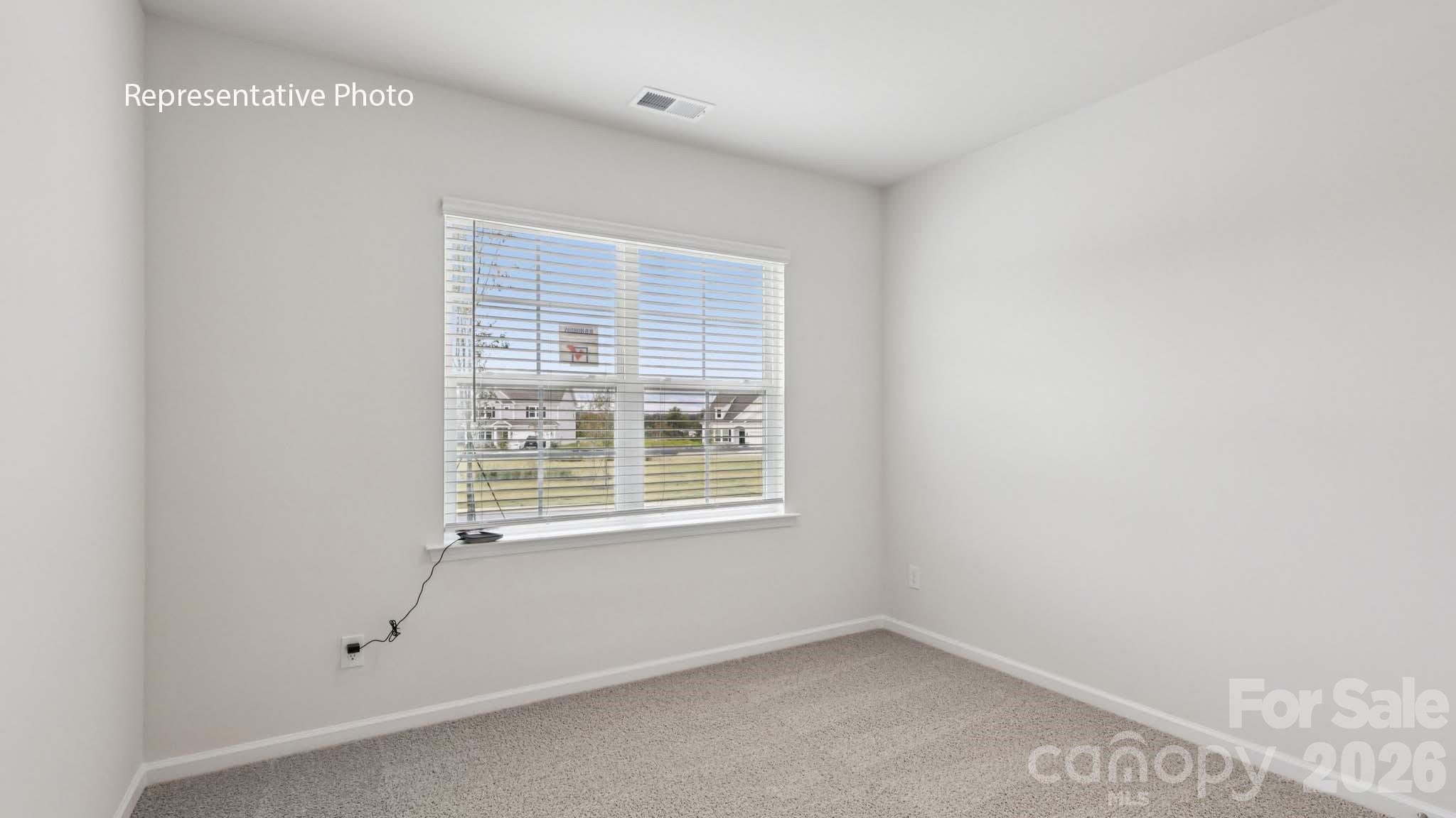 7608 Bainbridge Road Sherrills Ford, NC 28673 - Photo 17 of 28 a view of an empty room with a window