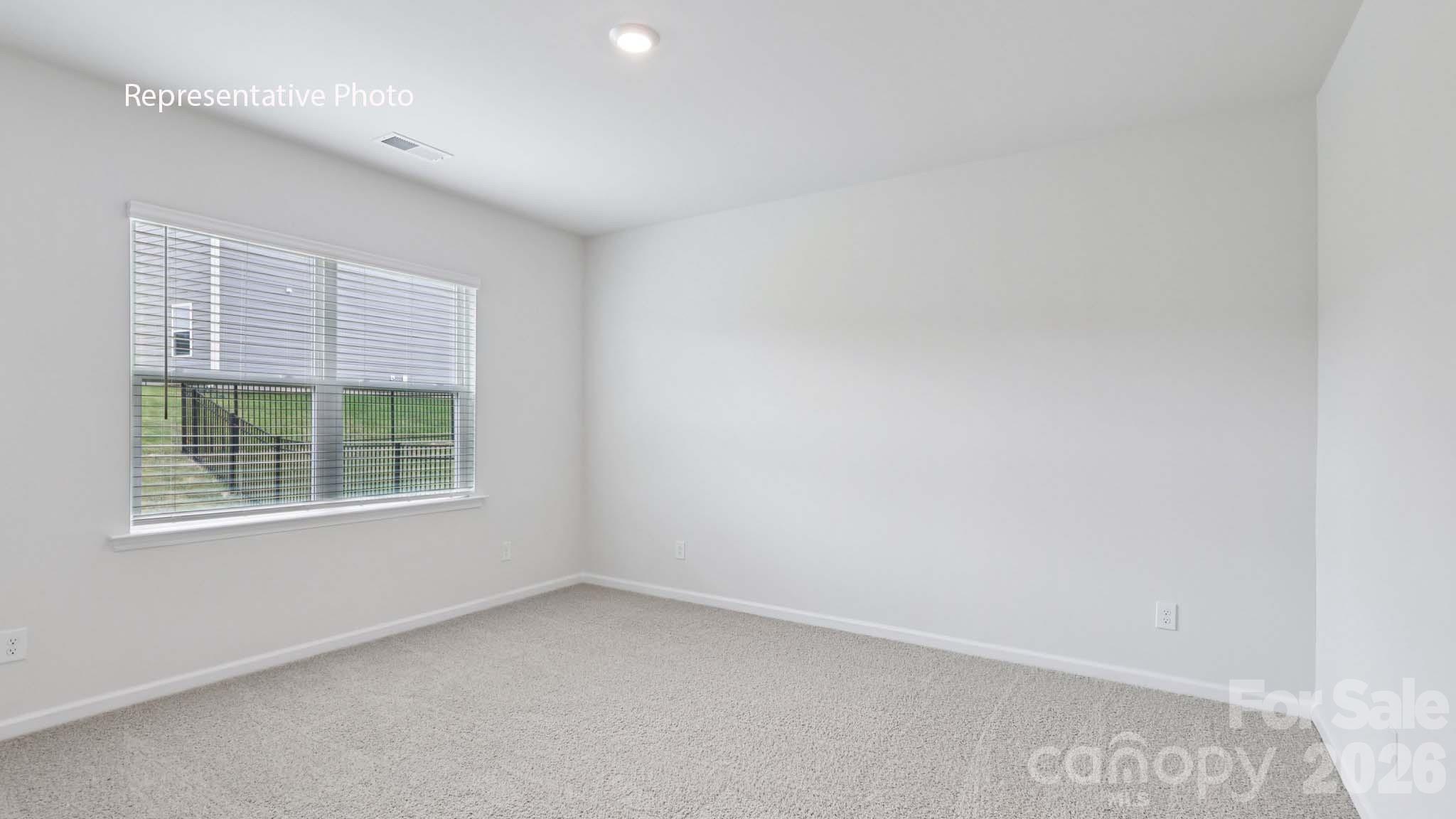 7608 Bainbridge Road Sherrills Ford, NC 28673 - Photo 25 of 28 an empty room with a window