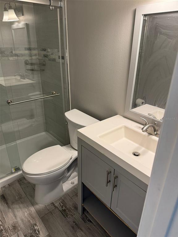 1030 Abada Court Northeast, Unit 110 Palm Bay, FL 32905 - Photo 12 of 14 a bathroom with a sink toilet and shower