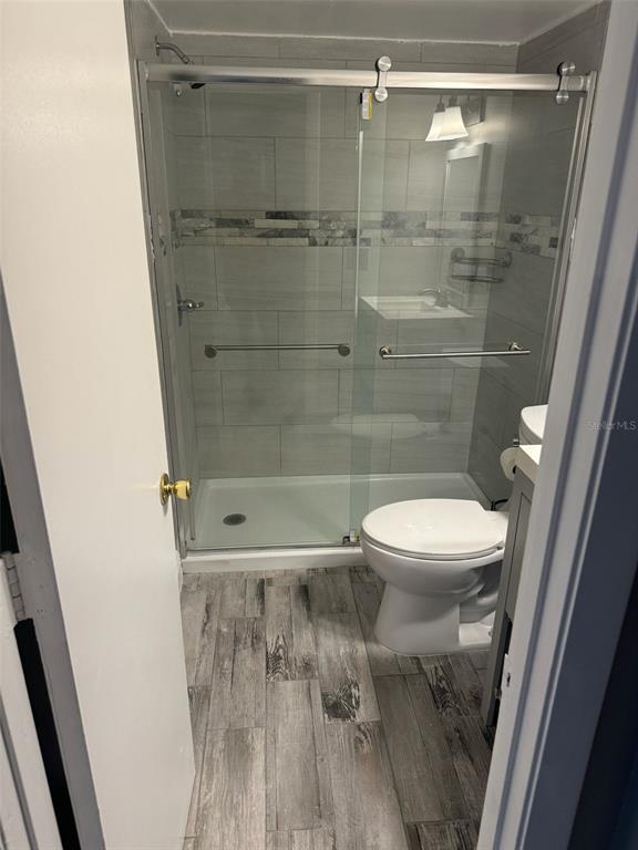 1030 Abada Court Northeast, Unit 110 Palm Bay, FL 32905 - Photo 4 of 14 a bathroom with a shower and a toilet