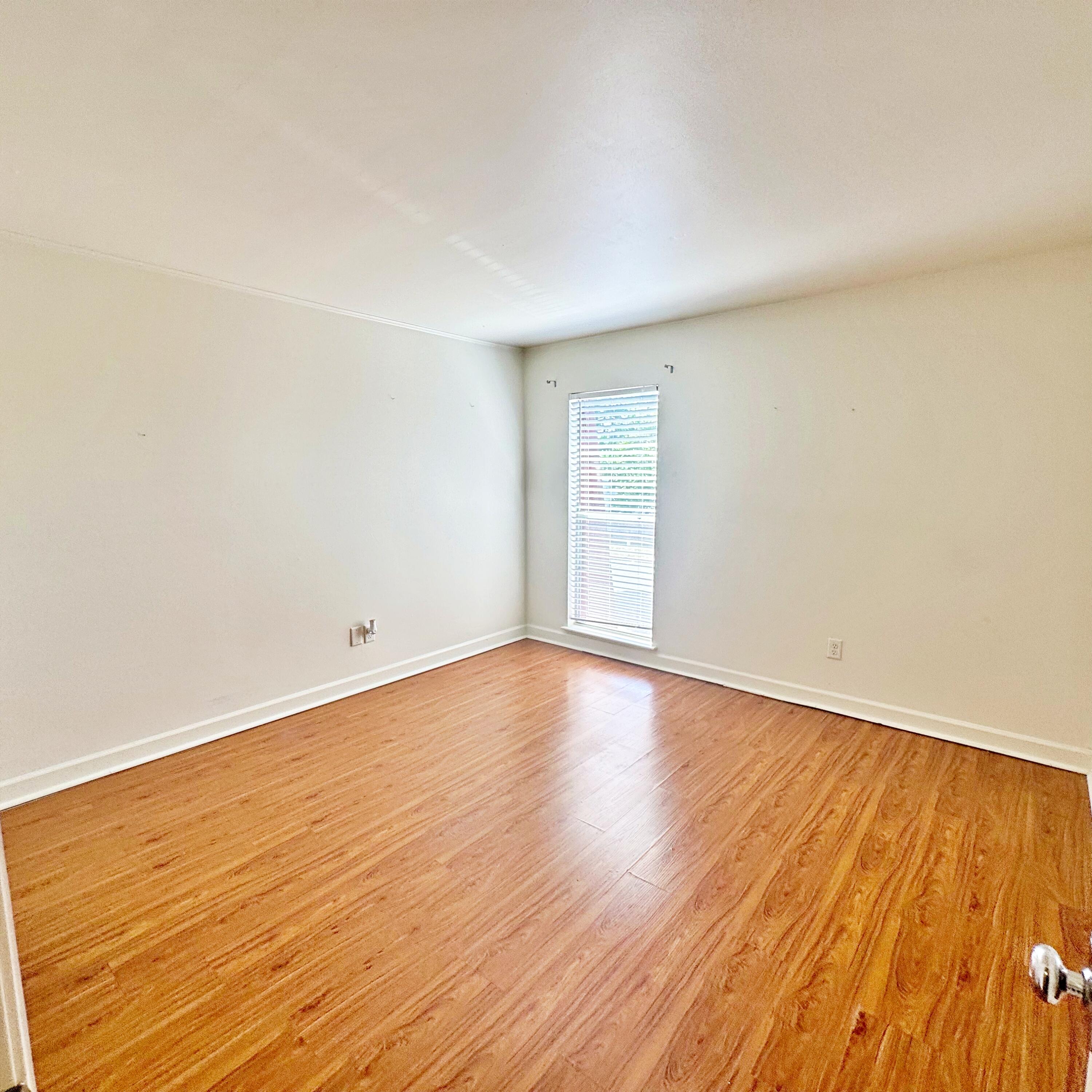 210 Pelham Road, Unit 215B Fort Walton Beach, FL 32547 - Photo 14 of 23 a view of empty room with wooden floor and fan