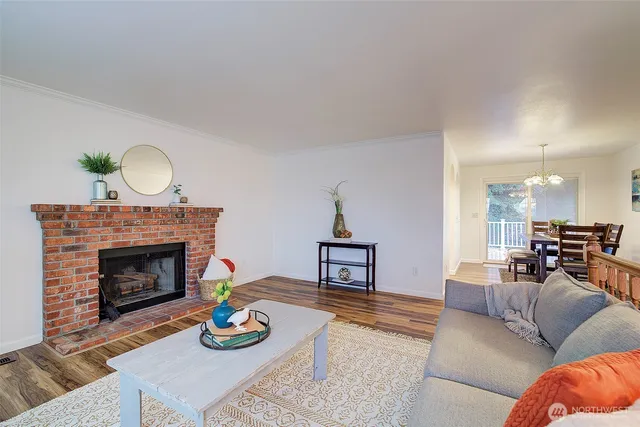 a view of a dining room with furniture and chandelier
