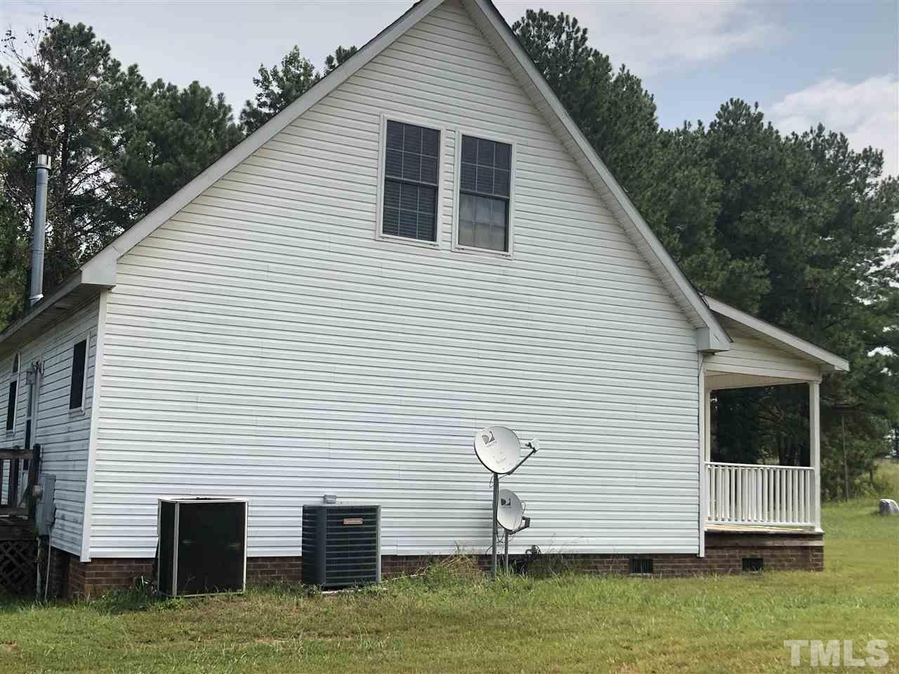 330-j B J B Leonard Road Castalia, NC 27816 - Photo 3 of 9 a front view of house with a garden