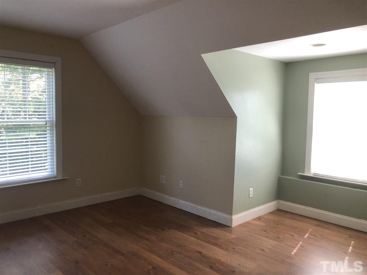 330-j B J B Leonard Road Castalia, NC 27816 - Photo 7 of 9 an empty room with wooden floor and windows